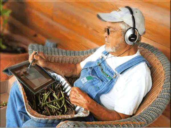 image of elderly man using a tablet to communicate as his business solution
