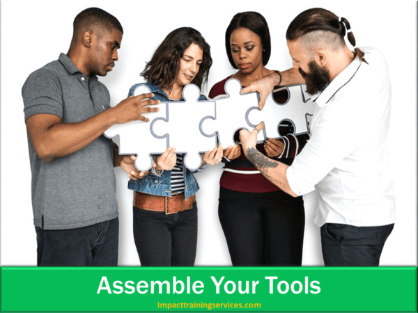 image of team assembling tools to write mission statement