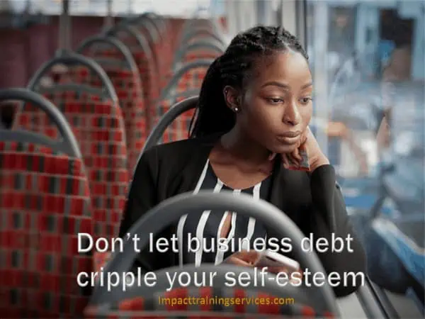 Sad female entrepreneur crippled by business debt