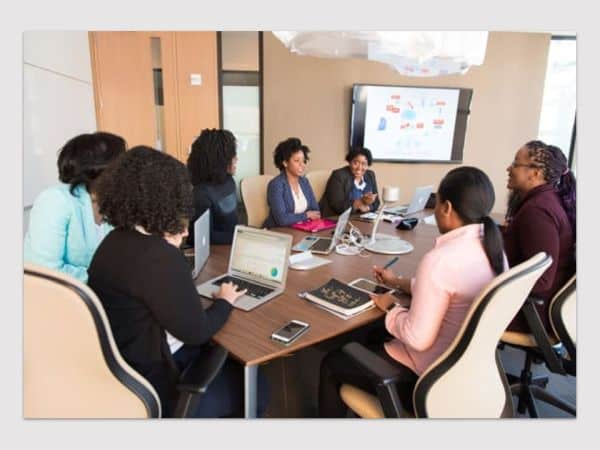 Image showing group of small business people discussing Impact Training & development Services