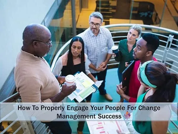 a group of managers discussing change management success