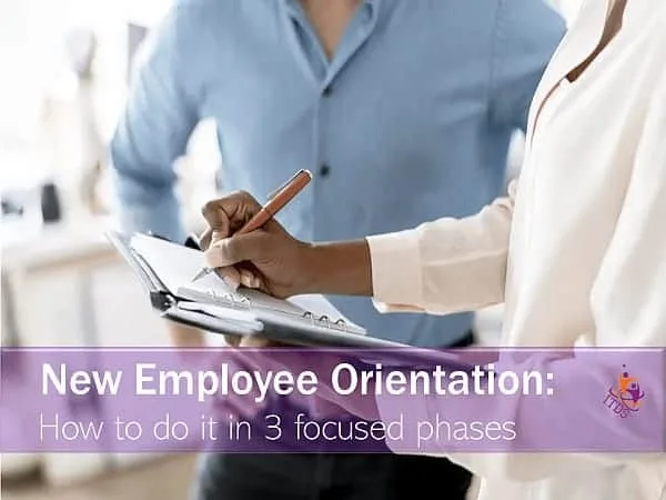 Small business owner taking notes on new employee orientation