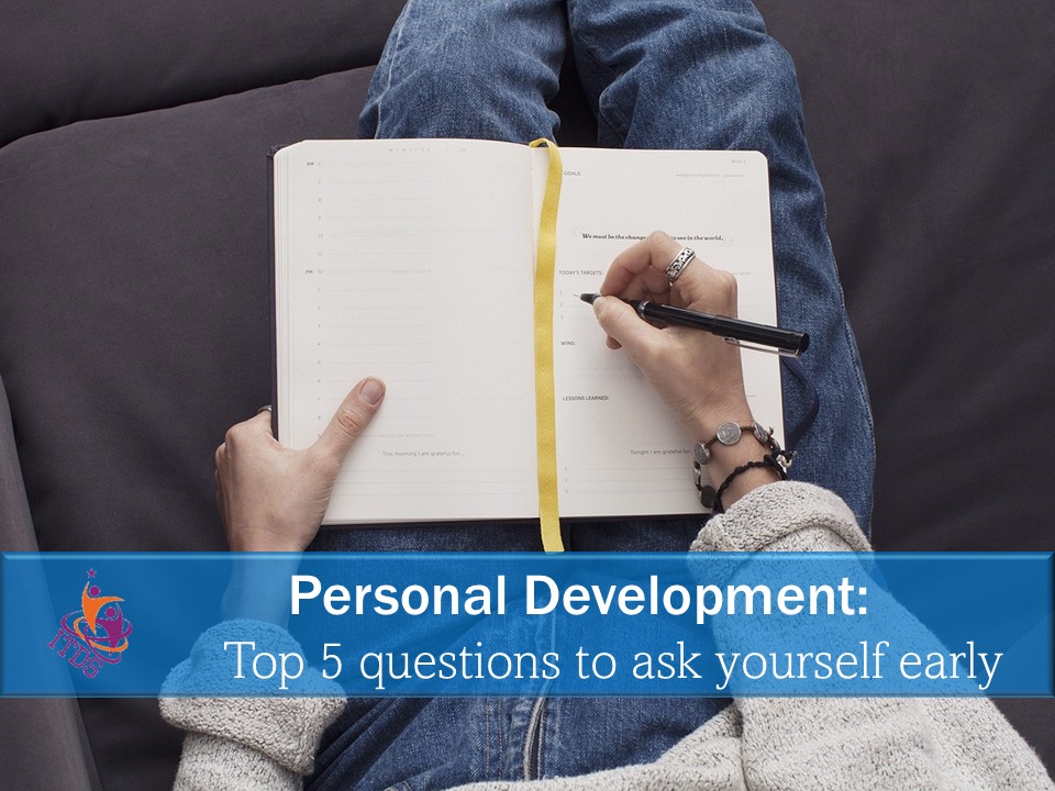 Female sitting with legs outstretched and crossed, writing in journal as part of her personal development
