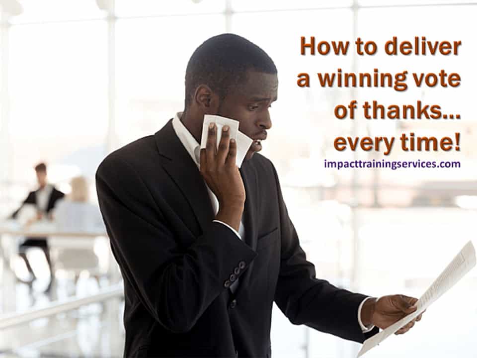 African-american man at a business meeting mopping his brow as he sweats to deliver a winning vote of thanks
