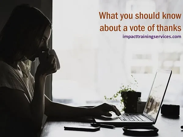 Woman at computer drinking coffee as she researches what you should know about a vote of thanks