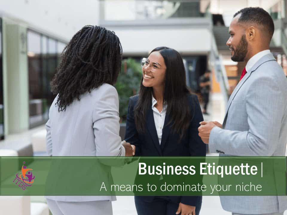 2 female business and one male engaging in businette etiquette