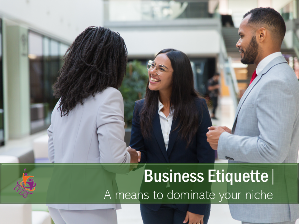 2 female business and one male engaging in businette etiquette