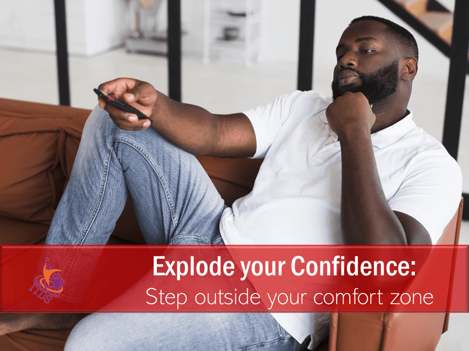 young black man lounging on sofa in his comfort zone, instead of exploding his confidence