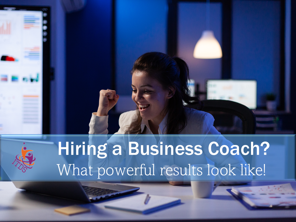 Woman celebrating having followed the advice in this post for hiring a business coach and gettin powerful results