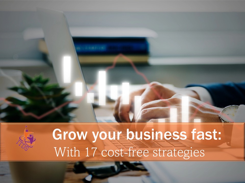 Image of hands on a computer as the owner researches how to grow your business fast