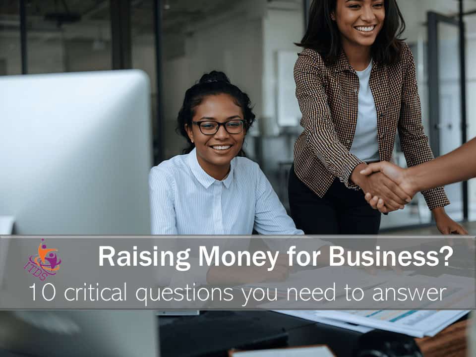 Two smiling women who have been successful at raising money for business