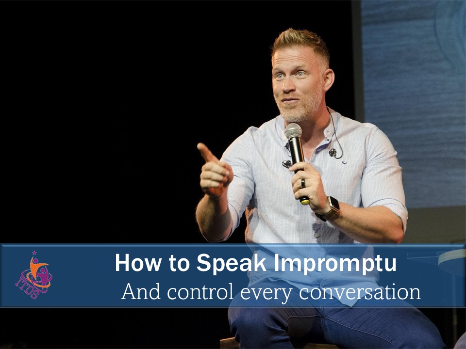 Caucasian man with microphone in hand demonstrating he knows how to speak impromptu