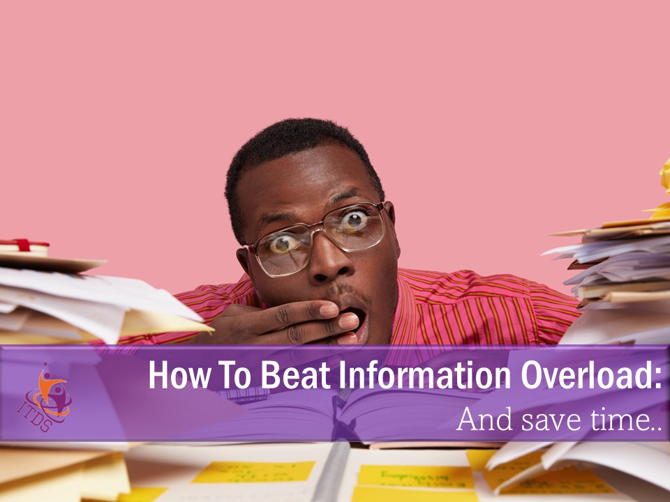 Male small business owner suffering from an acute case of information overload