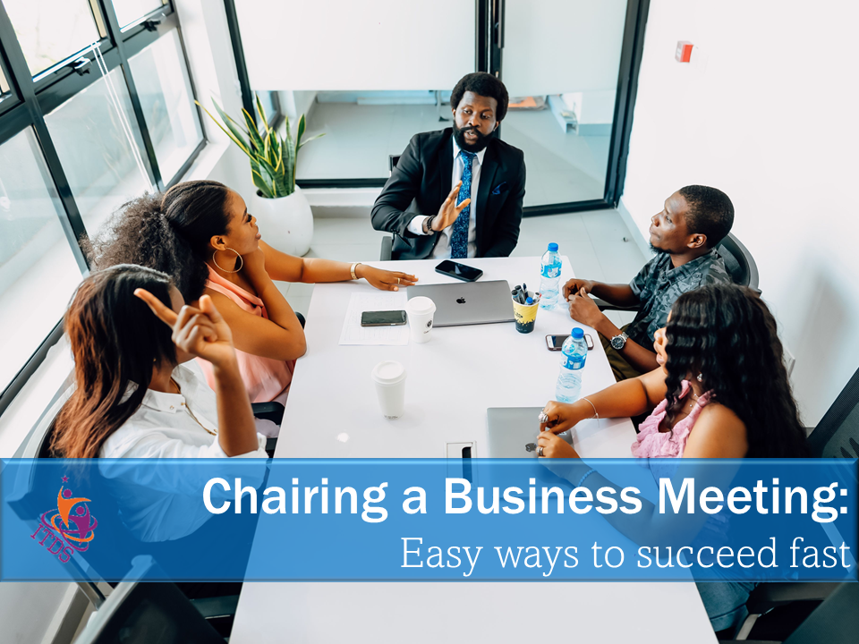 Image of businessman chairing a mixed gender team meeting